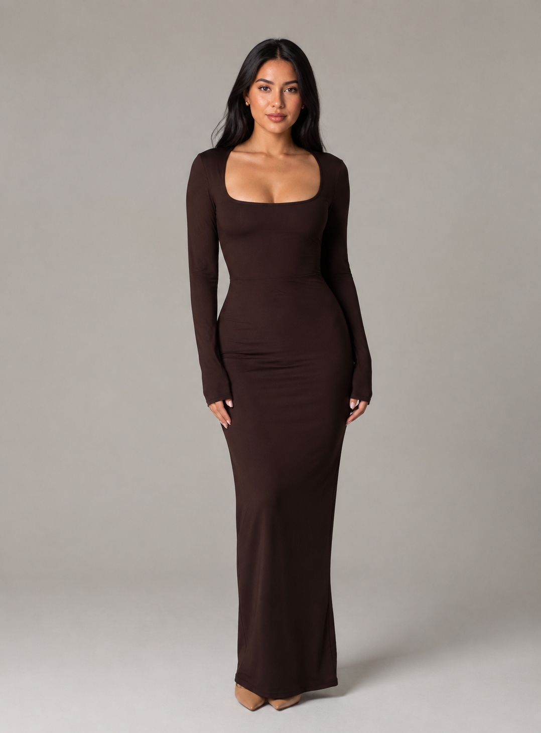 Woman wearing black long sleeve square neck bodycon maxi dress